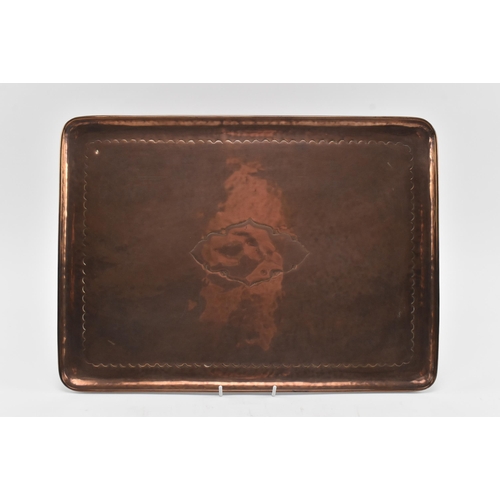 32 - Newlyn Copper - an early 20th century embossed Cornish copper tray. The tray of rectangular form wit... 