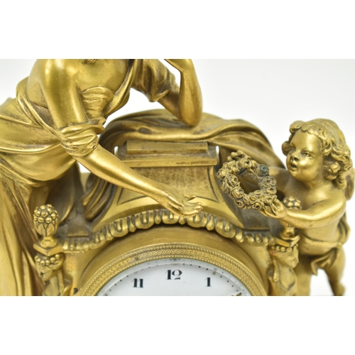 33 - A French mid 19th century gilded brass & marble 8-day mantel clock. The clock having a female al... 