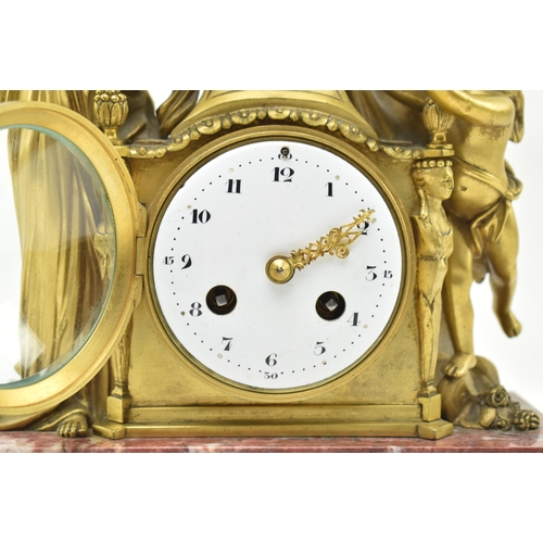 33 - A French mid 19th century gilded brass & marble 8-day mantel clock. The clock having a female al... 