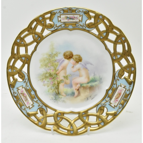 40 - Limoges - a late 19th century French porcelain cabinet plate, decorated with two hand painted cherub... 