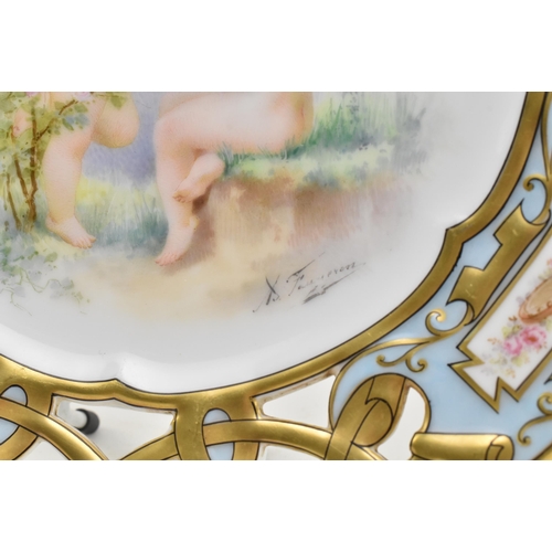 40 - Limoges - a late 19th century French porcelain cabinet plate, decorated with two hand painted cherub... 