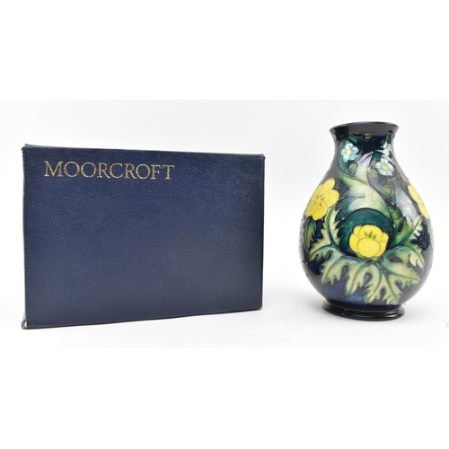 43 - Sally Tuffin for Moorcroft Pottery - Buttercup Pattern - a late 20th century 1991 tube lined ceramic... 