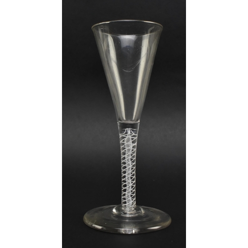 44 - A mid 18th century George II circa 1760 wine glass. The glass featuring funnel bowl over double opaq... 