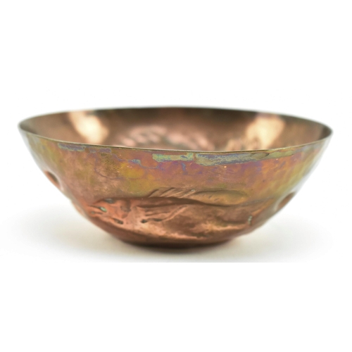 46 - Cornish Copper - an early 20th century repousse embossed copper bowl. The bowl decorated with fish, ... 