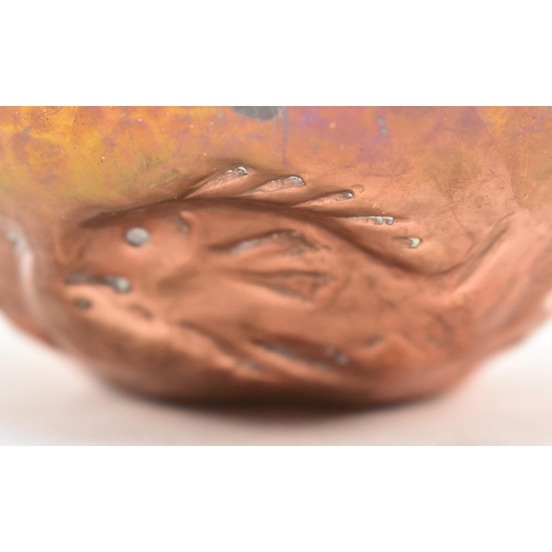 46 - Cornish Copper - an early 20th century repousse embossed copper bowl. The bowl decorated with fish, ... 