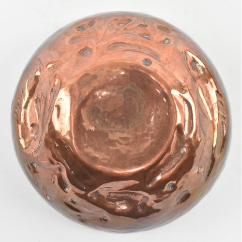 46 - Cornish Copper - an early 20th century repousse embossed copper bowl. The bowl decorated with fish, ... 