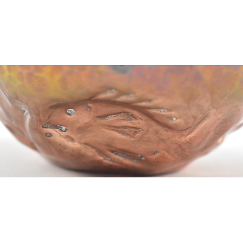 46 - Cornish Copper - an early 20th century repousse embossed copper bowl. The bowl decorated with fish, ... 