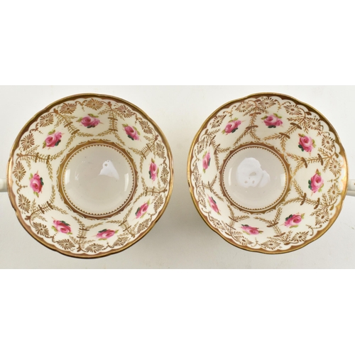 49 - A pair of 19th century English hand painted porcelain tea cups & saucers. Each cup and saucer in... 