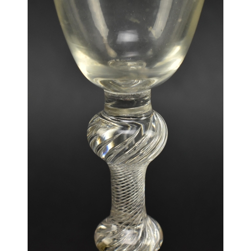 54 - A mid 18th century George II circa 1760 wine glass. The wine glass with funnel bowl over double knop... 