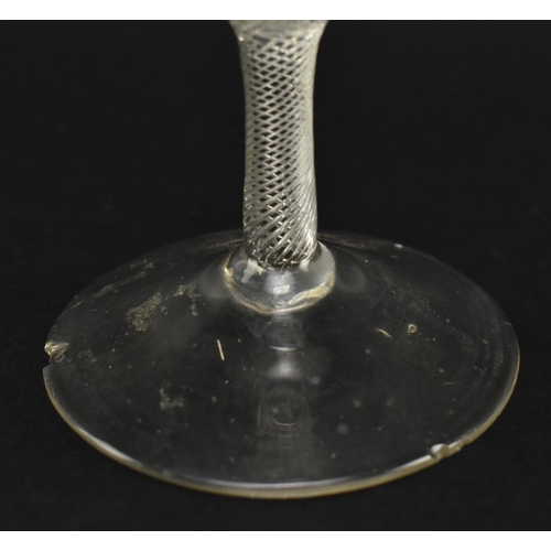 54 - A mid 18th century George II circa 1760 wine glass. The wine glass with funnel bowl over double knop... 