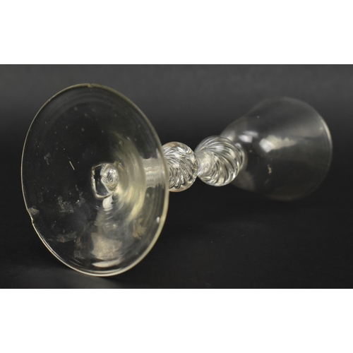 54 - A mid 18th century George II circa 1760 wine glass. The wine glass with funnel bowl over double knop... 