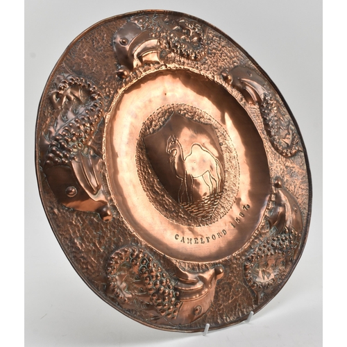 57 - Attributed to Charles Thomas Eustace (British, 1876-1957) - An Arts and Crafts Cornish copper repous... 