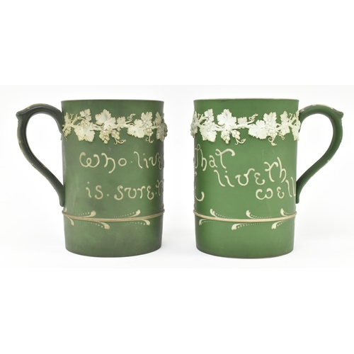 59 - Harry Barnard for Wedgwood - a pair of early 20th century c1900 jasperware mugs in olive green. Each... 