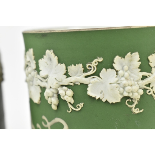 59 - Harry Barnard for Wedgwood - a pair of early 20th century c1900 jasperware mugs in olive green. Each... 