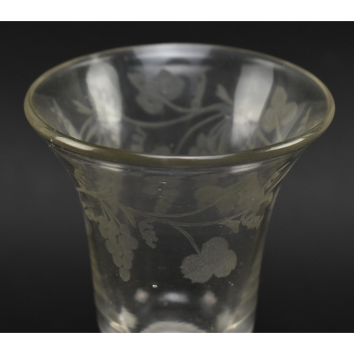 60 - A mid 18th century George II circa 1760 wine glass. The glass with bell shaped bowl featuring vine &... 