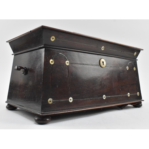 61 - An early 19th century rosewood and ebony strung inlaid tea caddy with mother of pearl detailing. The... 