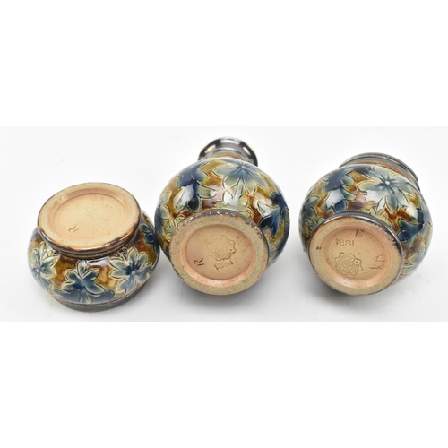 74 - Doulton Lambeth - a Victorian late 19th century circa 1881 stoneware glazed ceramic cruet set. The s... 