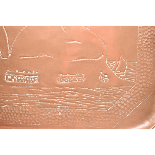 77 - Charles Thomas Eustace (British, 1876-1957) - An early 20th century Hayle hand embossed copper tray.... 