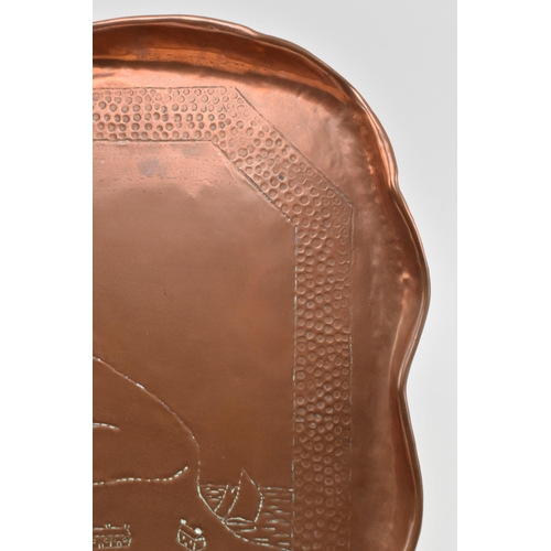 77 - Charles Thomas Eustace (British, 1876-1957) - An early 20th century Hayle hand embossed copper tray.... 