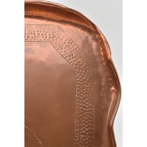 77 - Charles Thomas Eustace (British, 1876-1957) - An early 20th century Hayle hand embossed copper tray.... 