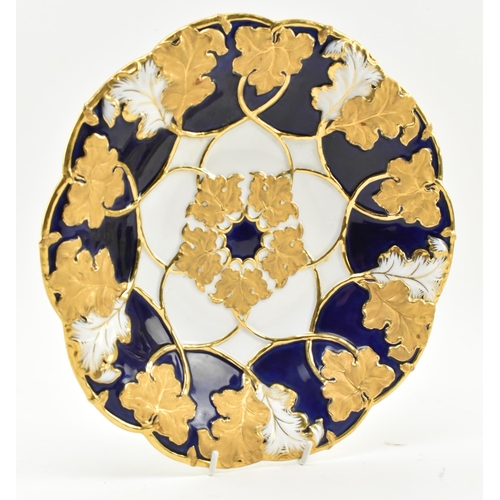 8 - A 19th century Meissen gilt & cobalt blue painted porcelain plate. The plate having a ribboned e... 