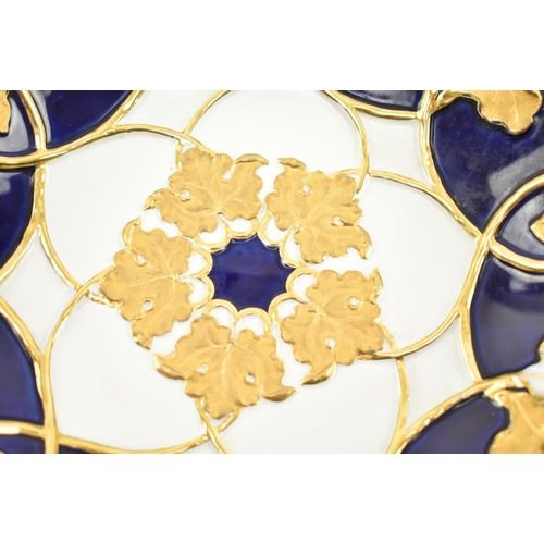 8 - A 19th century Meissen gilt & cobalt blue painted porcelain plate. The plate having a ribboned e... 