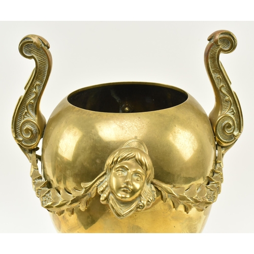 80 - A late 19th - early 20th century Neoclassical brass urn centrepiece vase. The centrepiece with twin ... 