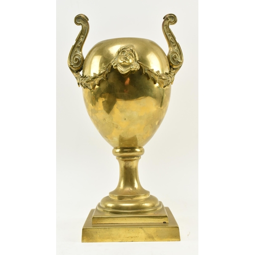 80 - A late 19th - early 20th century Neoclassical brass urn centrepiece vase. The centrepiece with twin ... 