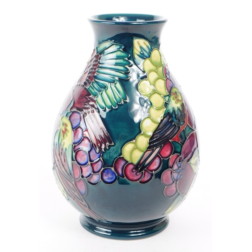 81 - William Moorcroft - Finches and Fruit pattern - a late 20th century ceramic vase designed by Sally T... 