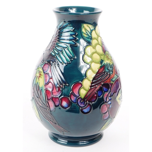 81 - William Moorcroft - Finches and Fruit pattern - a late 20th century ceramic vase designed by Sally T... 