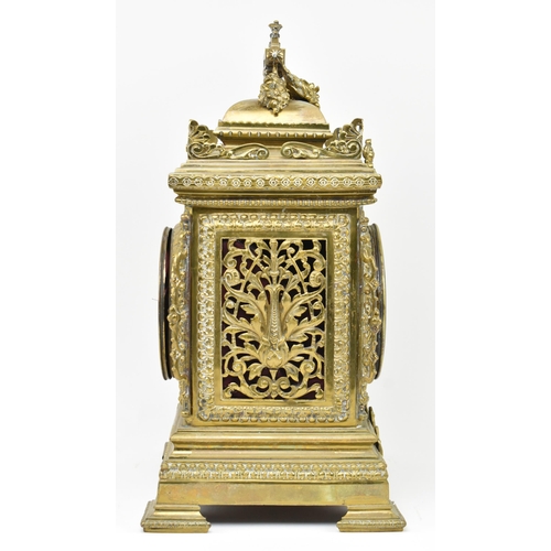 97 - An early 20th century French gilt brass 8 day mantle clock. The clock featuring gilt finial swag, pi... 