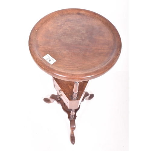 181 - A George III late 18th century mahogany floor wig stand. The stand having a concave circular top wit... 