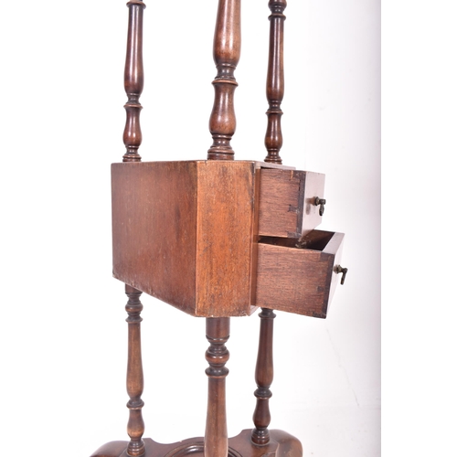 181 - A George III late 18th century mahogany floor wig stand. The stand having a concave circular top wit... 