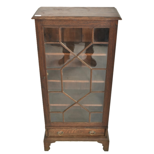 183 - A 19th century oak pedestal library bookcase cabinet. The upright bookcase having a flared rectangul... 