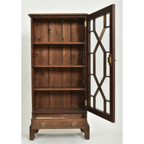 183 - A 19th century oak pedestal library bookcase cabinet. The upright bookcase having a flared rectangul... 