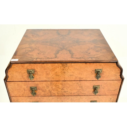 186 - A Queen Anne Revival early 20th century figured walnut veneered chest of drawers on stand. The chest... 