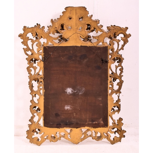 187 - An Italian Venetian 19th century giltwood wall mirror specchiera. The mirror having an intricately c... 