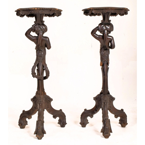 190 - A pair of Italian late 19th century ebonised wood decorative blackamoor torchere plant stands. Each ... 