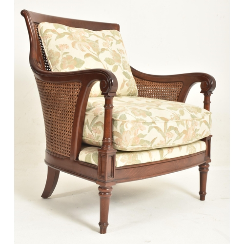 192 - A 20th century Wesley-Barrell mahogany framed and caned armchair. The chair having a curved backrest... 