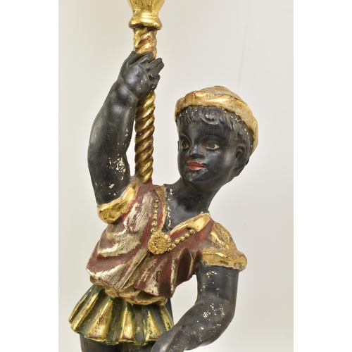 194 - A pair of 19th century Victorian hand carved & gilded Blackamoor figurines, each figured holding... 