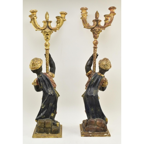 194 - A pair of 19th century Victorian hand carved & gilded Blackamoor figurines, each figured holding... 