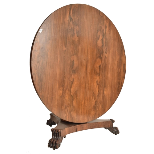 196 - A William IV 19th century rosewood tilt top breakfast loo table. The table having a circular top wit... 