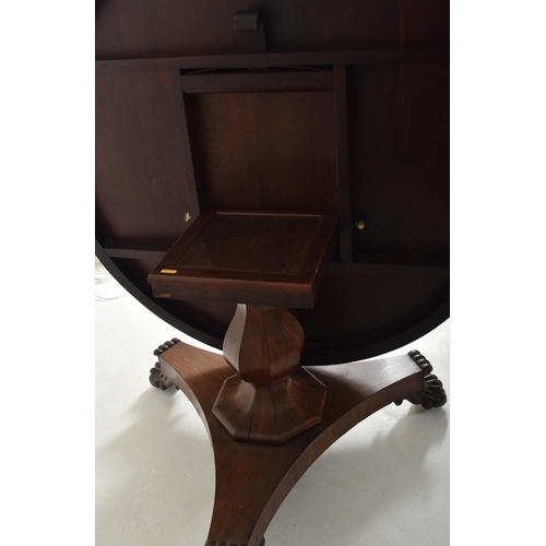 196 - A William IV 19th century rosewood tilt top breakfast loo table. The table having a circular top wit... 