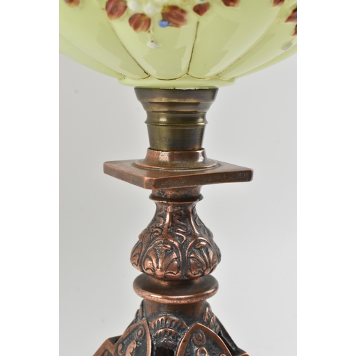 197 - An Art Nouveau 19th century two tone vaseline glass and coppered metal oil lamp. The lamp having a c... 