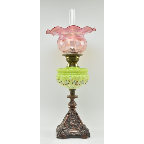 197 - An Art Nouveau 19th century two tone vaseline glass and coppered metal oil lamp. The lamp having a c... 