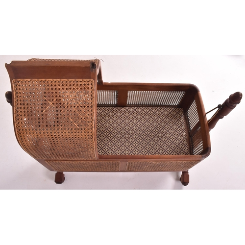 204 - An early 19th century William IV mahogany framed & cane rattan rocking cot crib. The child's cra... 