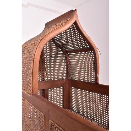 204 - An early 19th century William IV mahogany framed & cane rattan rocking cot crib. The child's cra... 