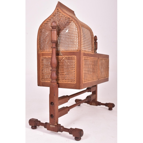 204 - An early 19th century William IV mahogany framed & cane rattan rocking cot crib. The child's cra... 