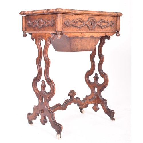 214 - A High Victorian 19th century walnut lyre leg work ladies workbox sewing table. The table having a r... 