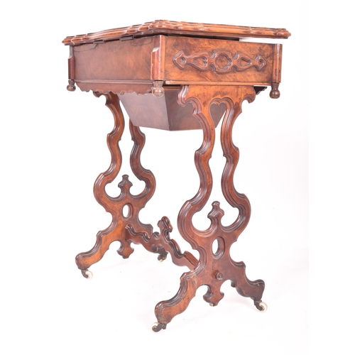 214 - A High Victorian 19th century walnut lyre leg work ladies workbox sewing table. The table having a r... 